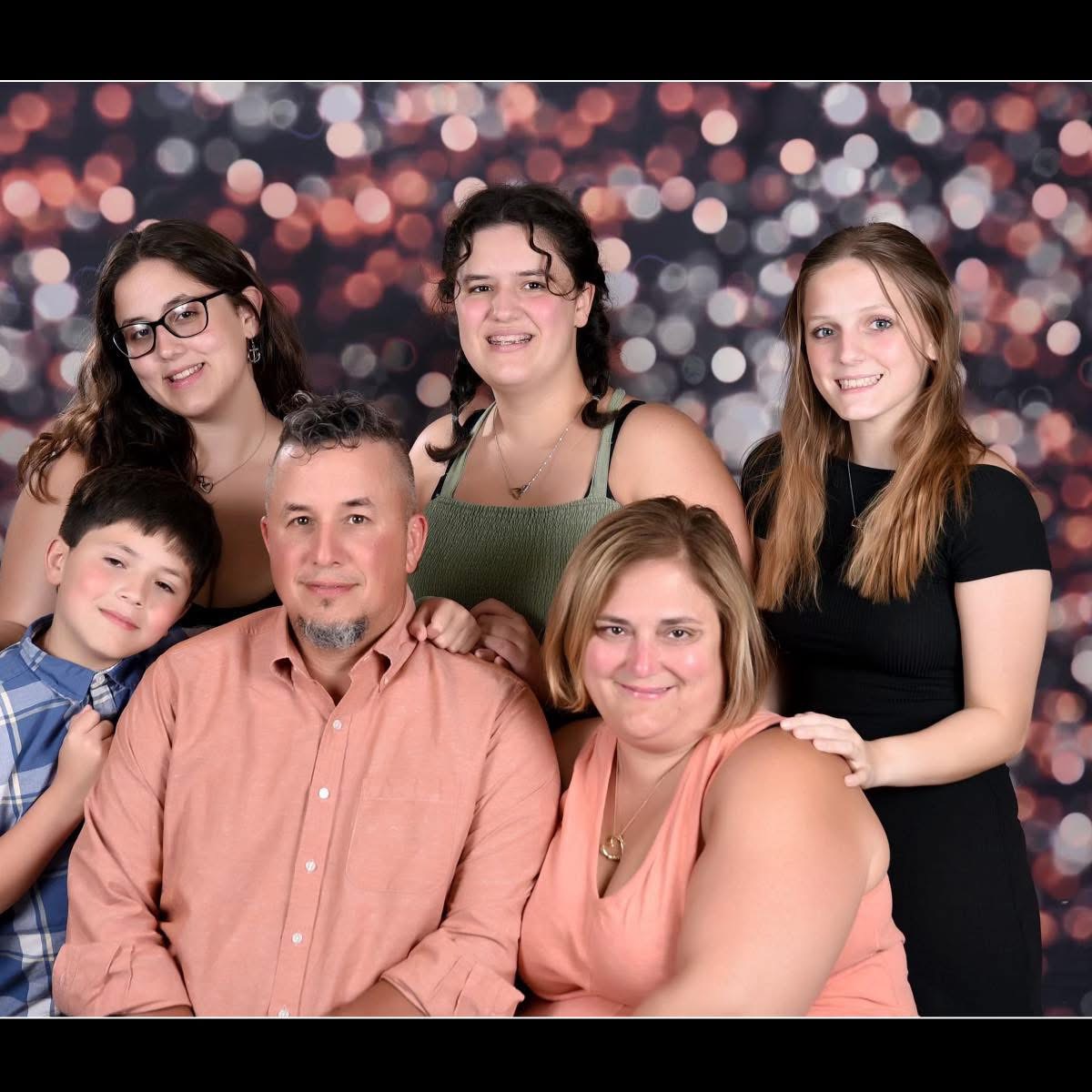 Joe Martino with his wife Erica and their children